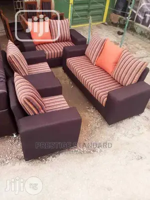 A Standard 7 Seater of a Well Made Fabrics Sofa