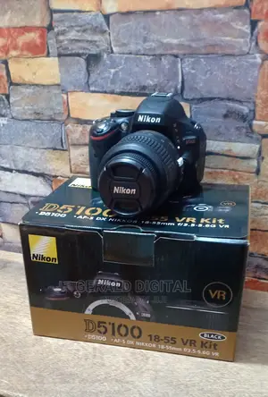 Nikon D5100 Camera. The Lens Is 18-55mm Camera