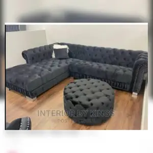 L-Shaped Chesterfield Fabric Sofa With an Ottoman