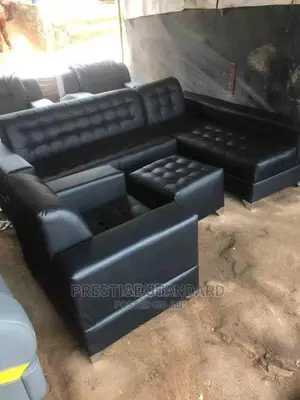 A Seven Seater of Leather Sofa, With Center Table