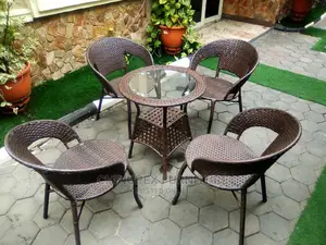 4 Seater Set of Rattan Cane Chairs and Glass Top Table.