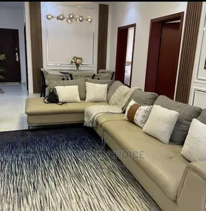 Modern L-Shaped Sofa With Throw Pillows