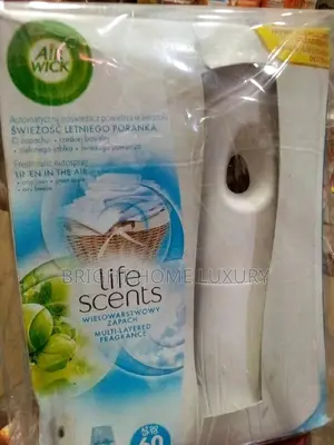 Air Wick Air Freshener Automatic Dispenser (With a Refill)