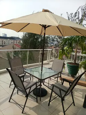 Italian Outdoor Unbrella With Tables and 4 Chairs