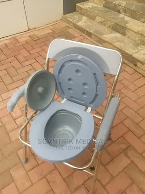 Chair With Padded Mobile Over Pregnant Woman Toilet Seat