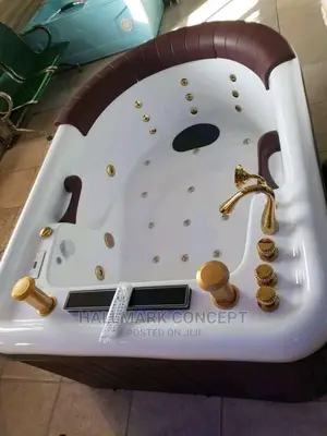 Double Jacuzzi Bath With Gold Accessories