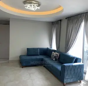 Modern L-Shaped Sofa With Throw Pillows