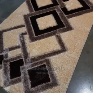 5*7fts Cream and Brown Designed Center Rug.