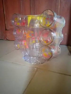 Glassware With Cups, Stainless Stand, and Jug.