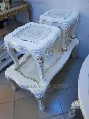 Royal Design Center Table With Tempered Glass Top on It.