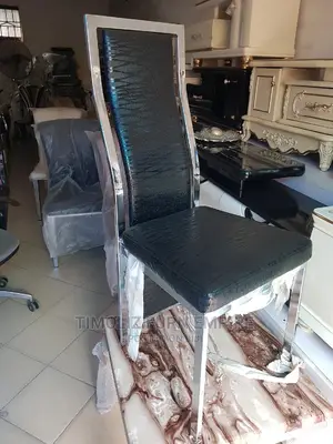 High Quality Dining Chair With Stainless Frame Round It.