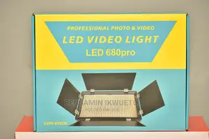 Video Light With Batteries, Charger, and Power Cord.