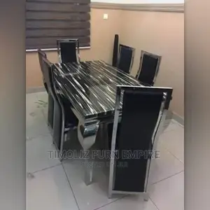 Marble Dinning Table With 6 Rust Resistant Chair-Black.
